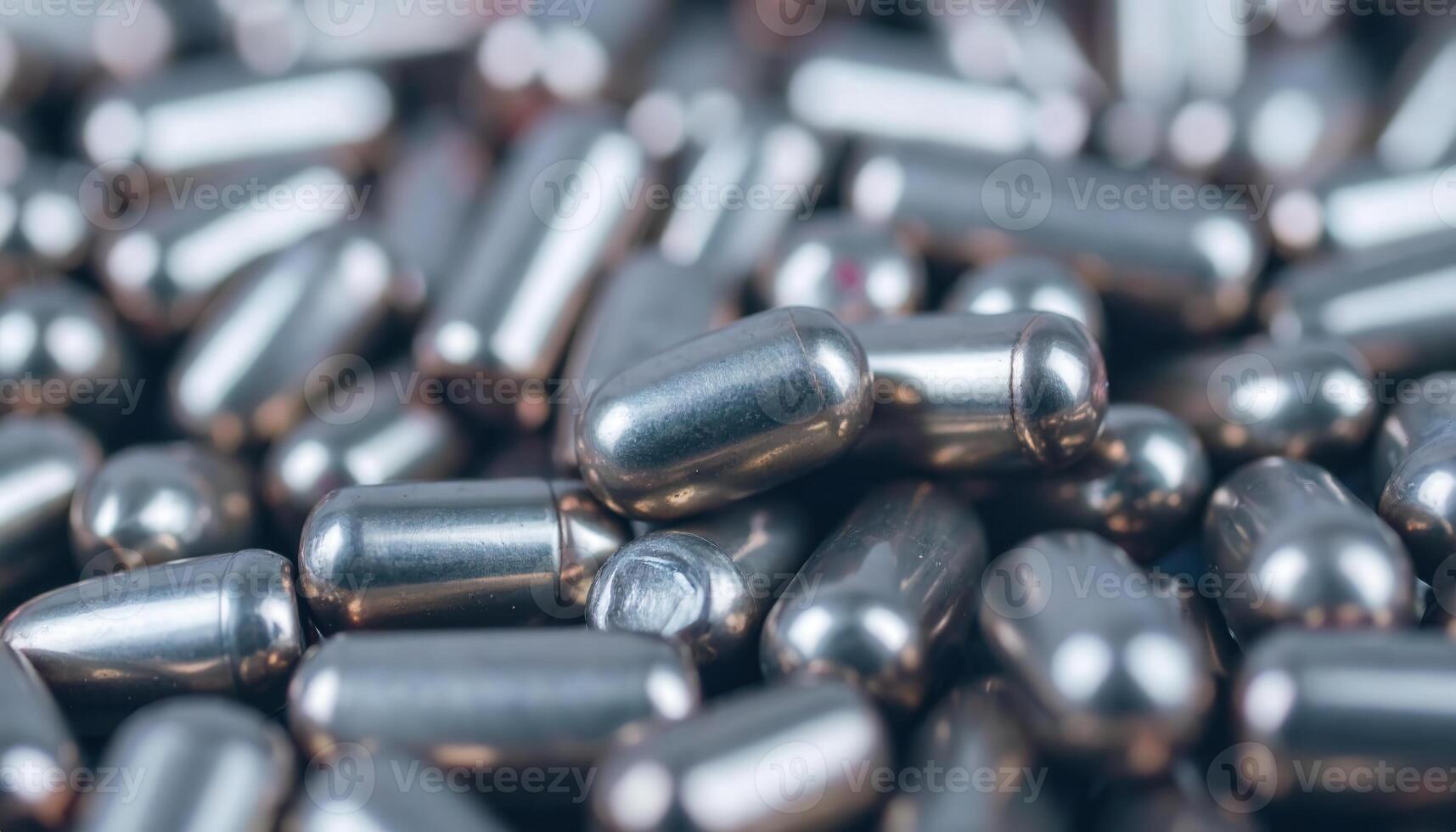 Close-Up of Shiny Metallic Capsules on a Surface for Engine and AI Insights photo