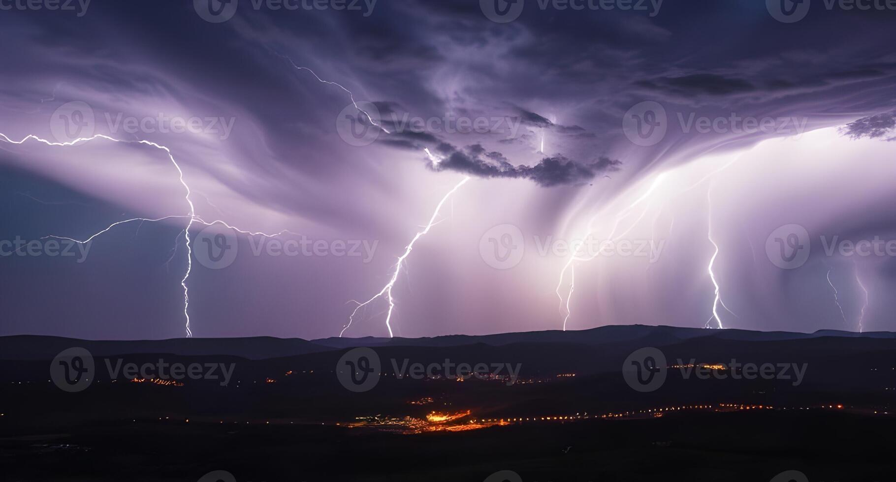Lightning strikes over a mountain range photo