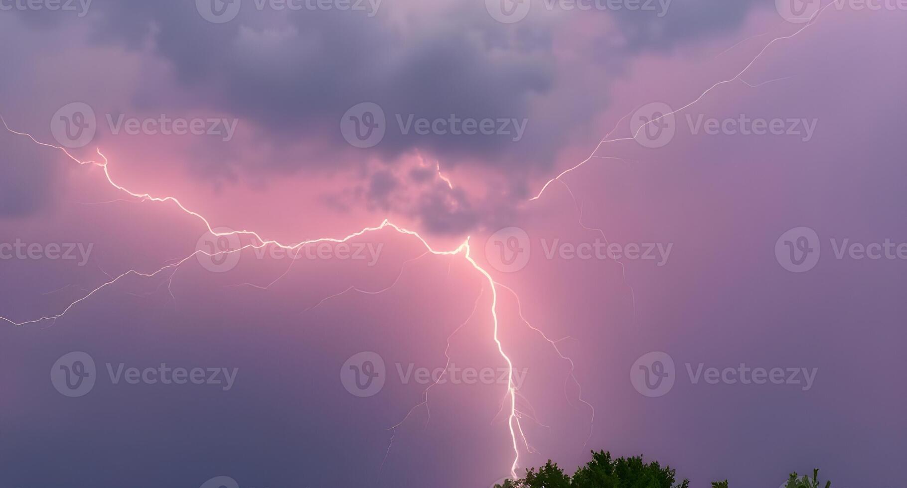 Lightning strikes over a tree in the sky photo