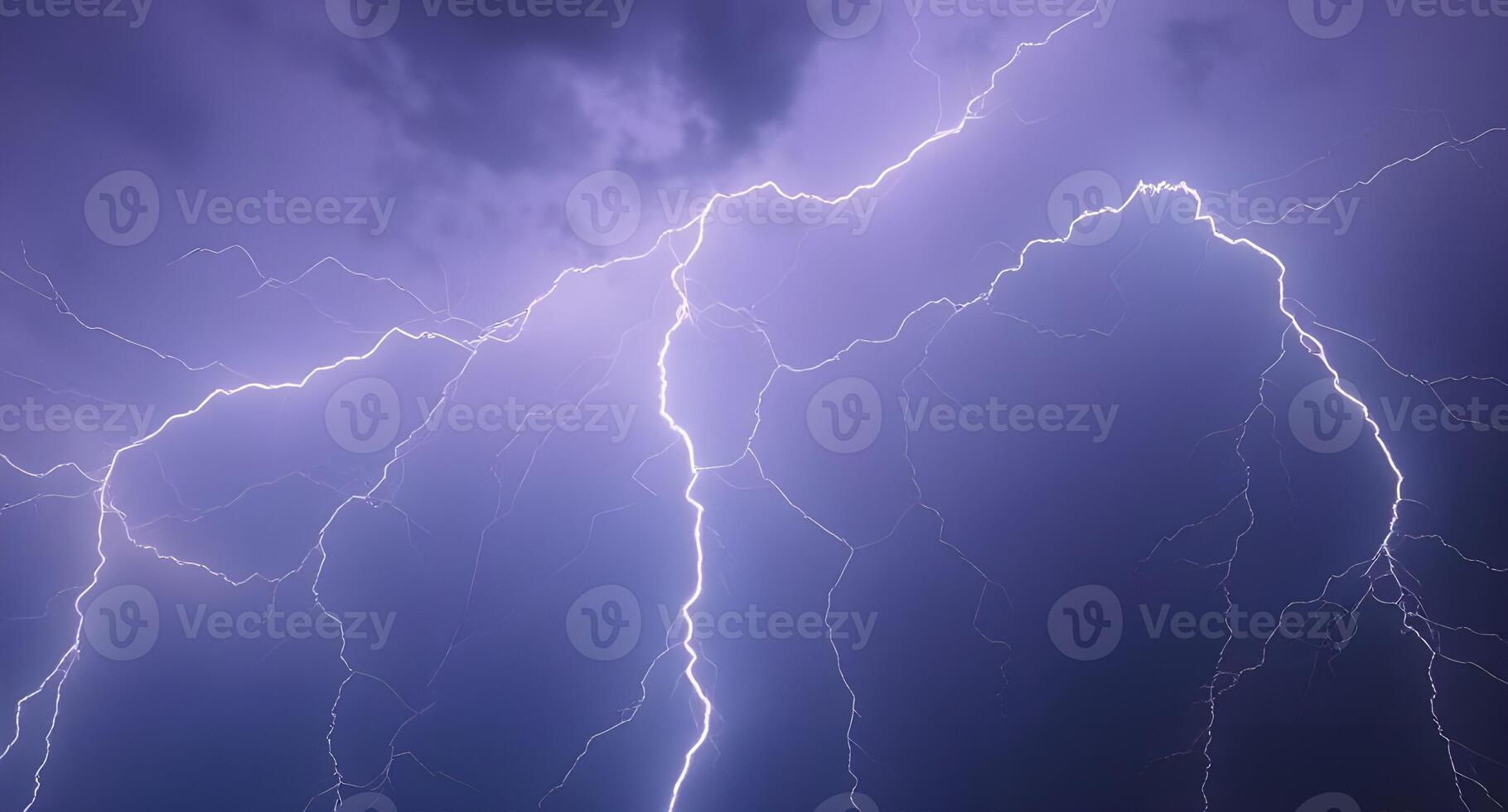Lightning strikes over a dark sky with clouds photo