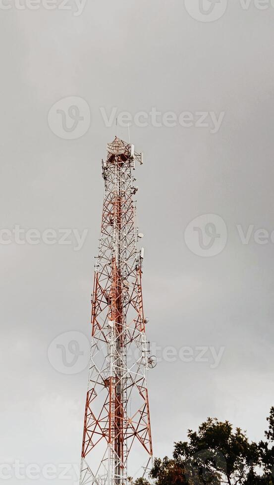 A tower with a red and white tower photo