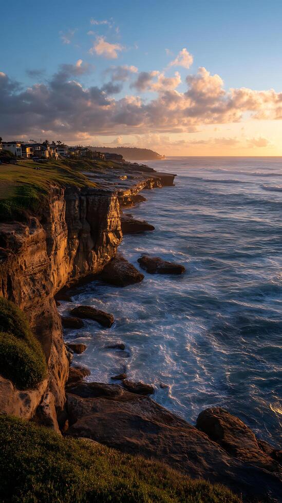 coastal cliffside sunset with ocean waves and dramatic sky photo