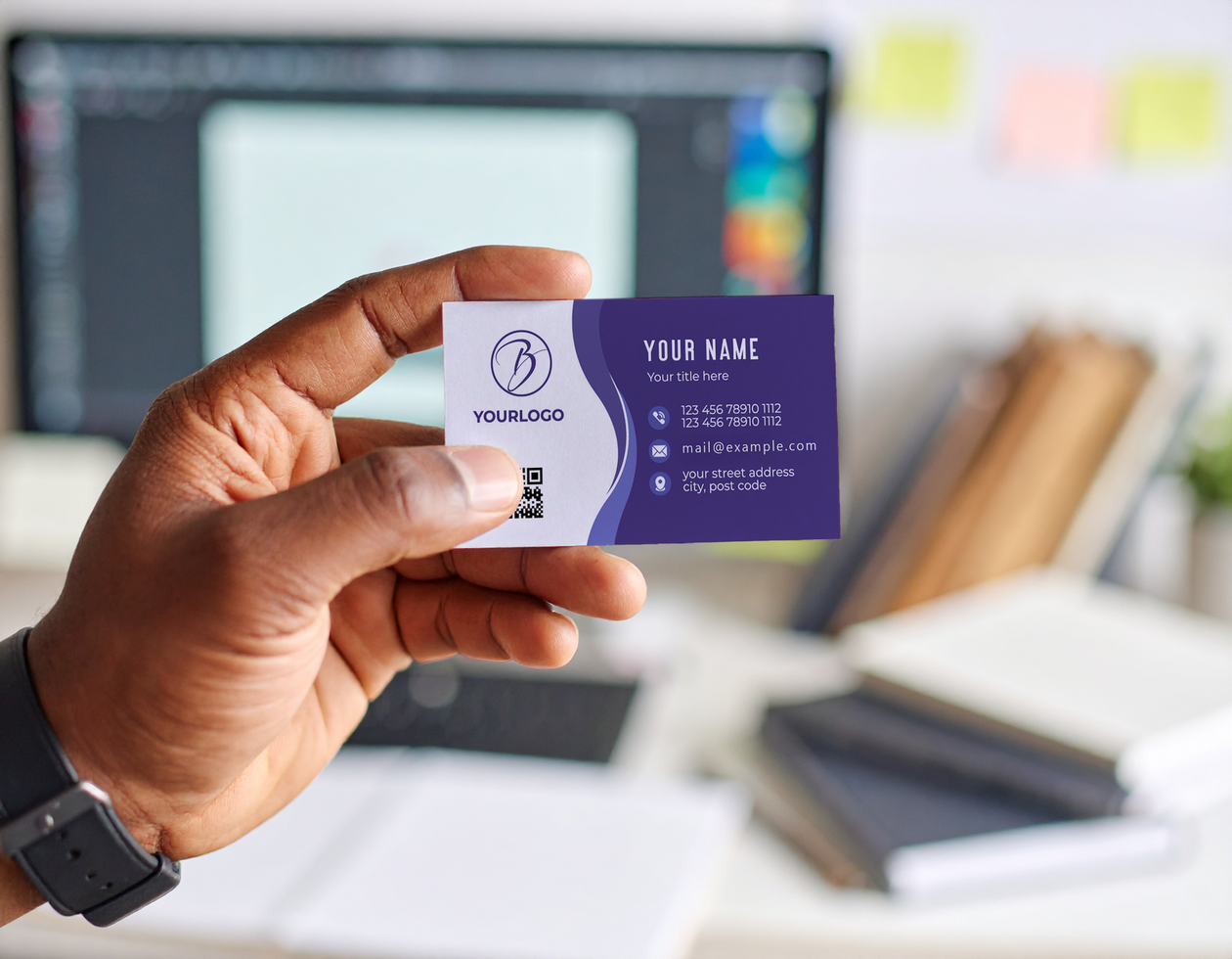 Hand Holding Business Card Mockup in Office Workspace Setting psd