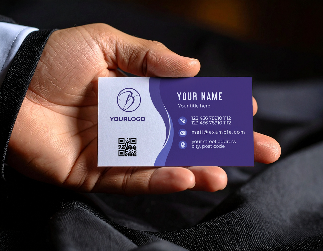 Person in Suit Holding Minimalist Business Card Mock Up psd