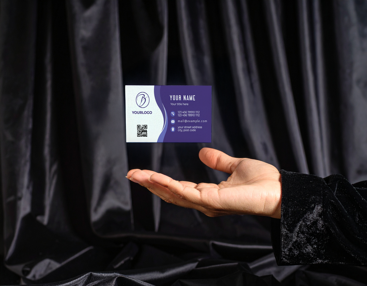 Hand in Black Velvet Holding Card Mockup Dark Backdrop psd