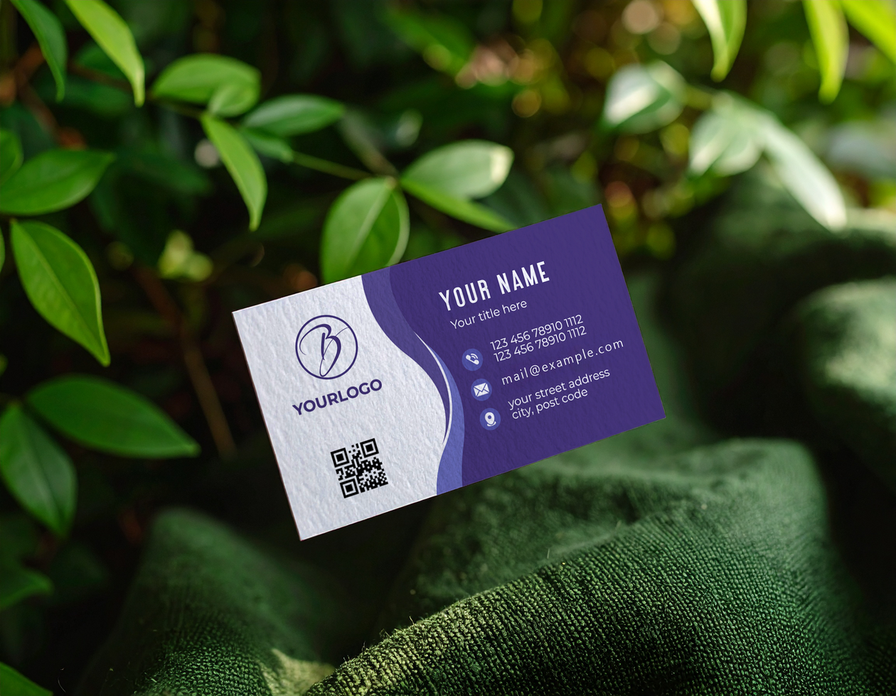 Business Card Mockup Above Dark Green Fabric Leaves psd