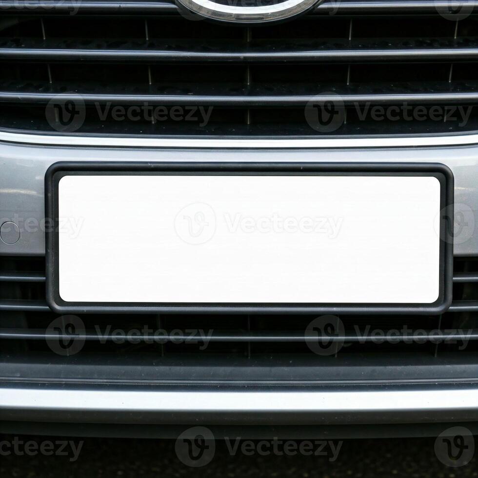 Mock plain white license plate on a car bumper photo
