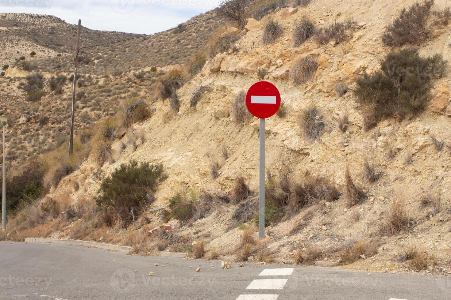 Exploring the deserted landscapes of Spain with a focus on local road signs and natural scenery photo
