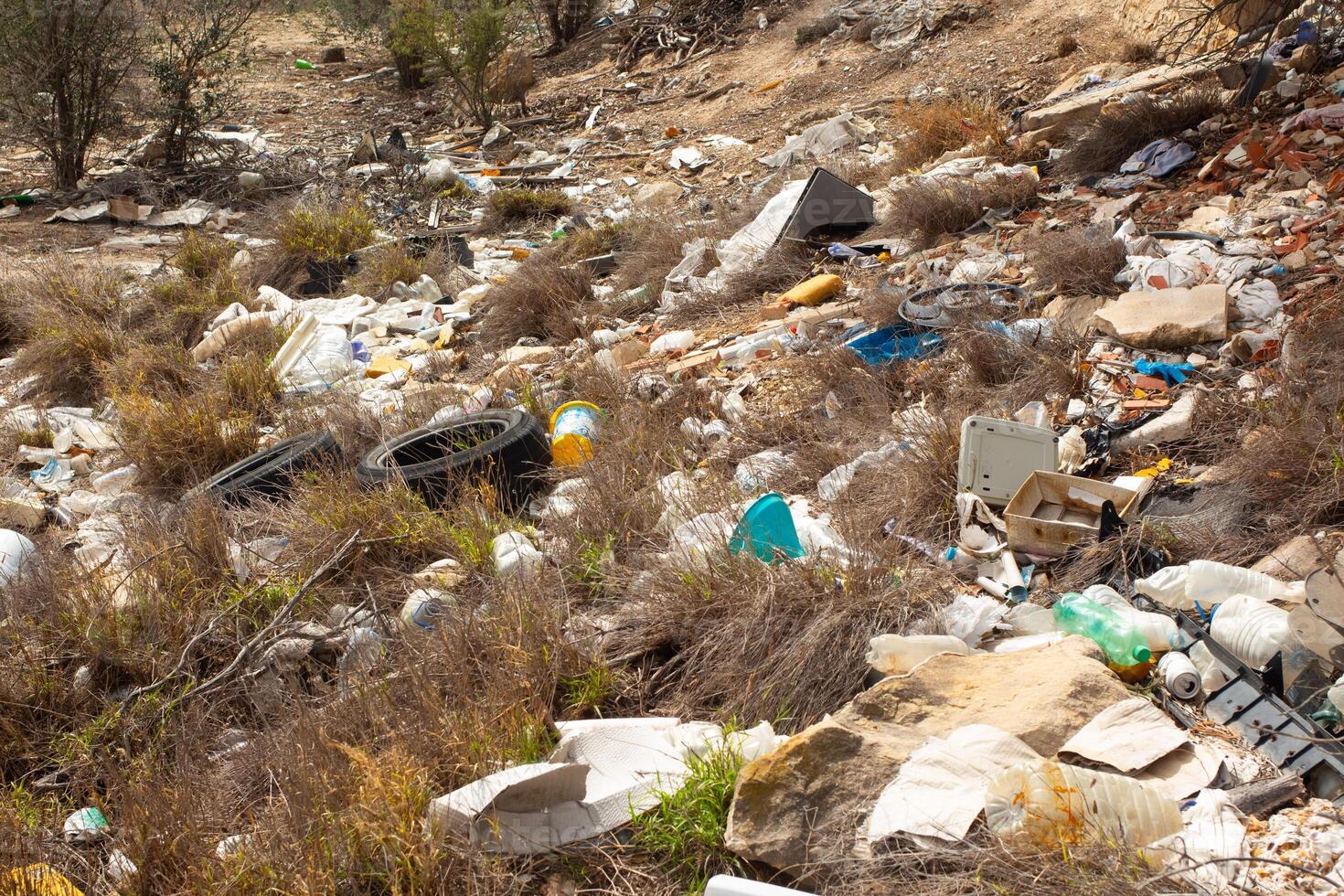 Littered landscape in Spain depicting environmental concerns and issues of tourism management photo