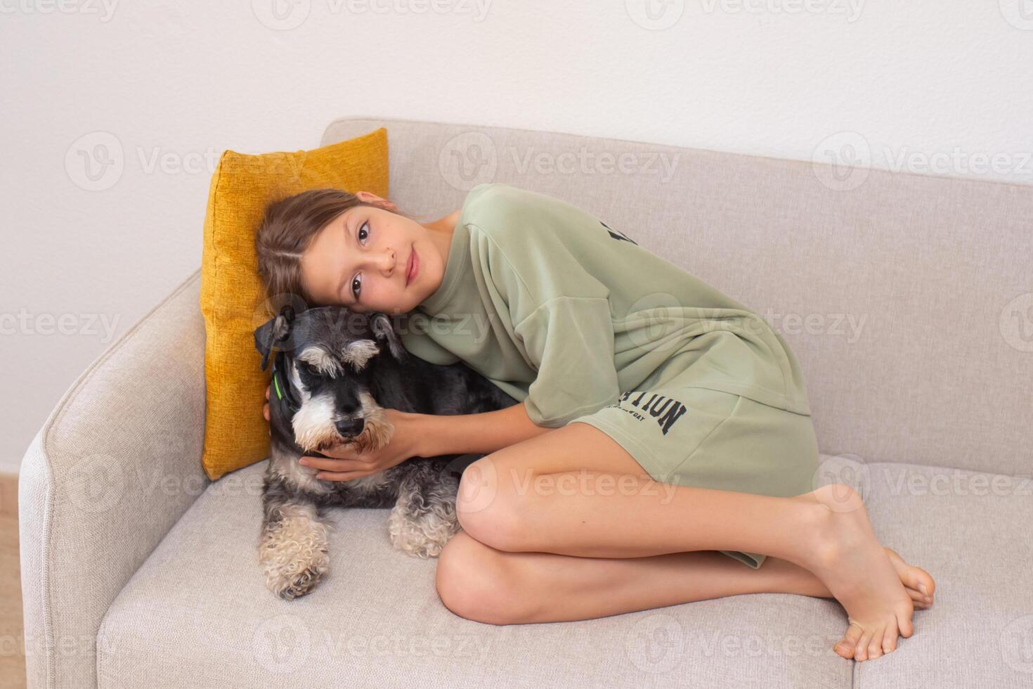 Children play with dog on couch at home creating joyful memories together during a cozy afternoon photo