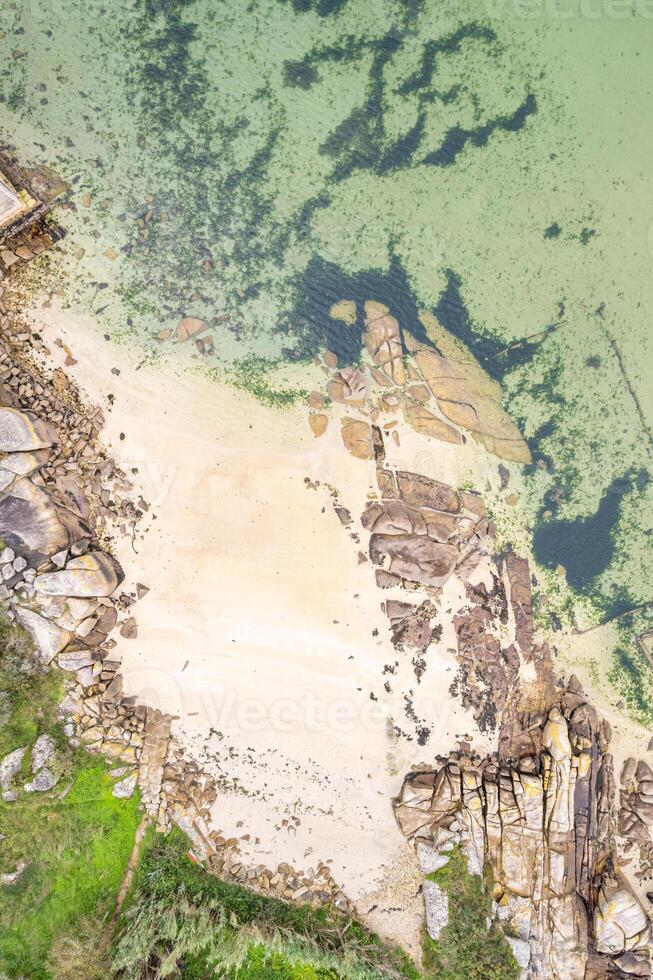 drone shot of a pristine coastline with clear turquoise water Drone zenithal view, summer background concept photo