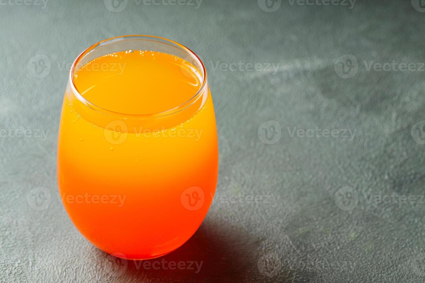 Dirty Soda in Transparent Glass on Green Background, Trendy Carbonated Drink Concept, Copy Space photo