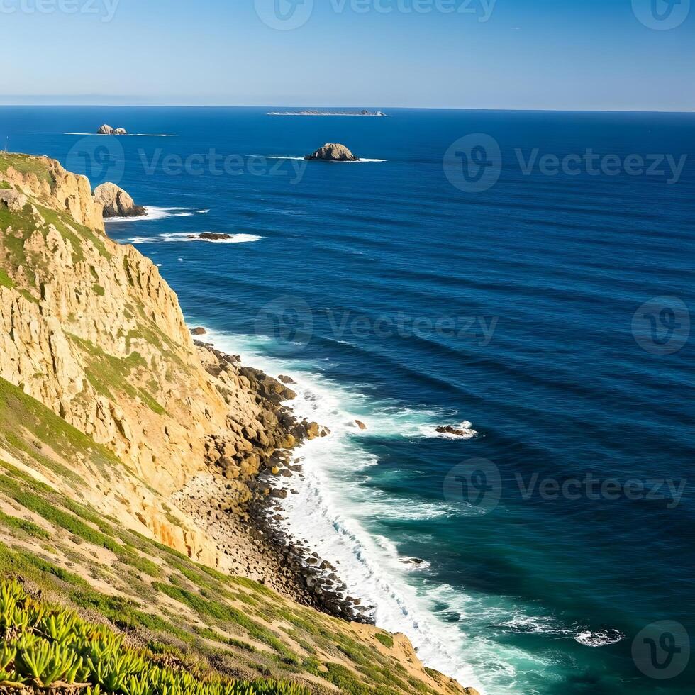 A view of the ocean from a cliff overlooking the ocean photo