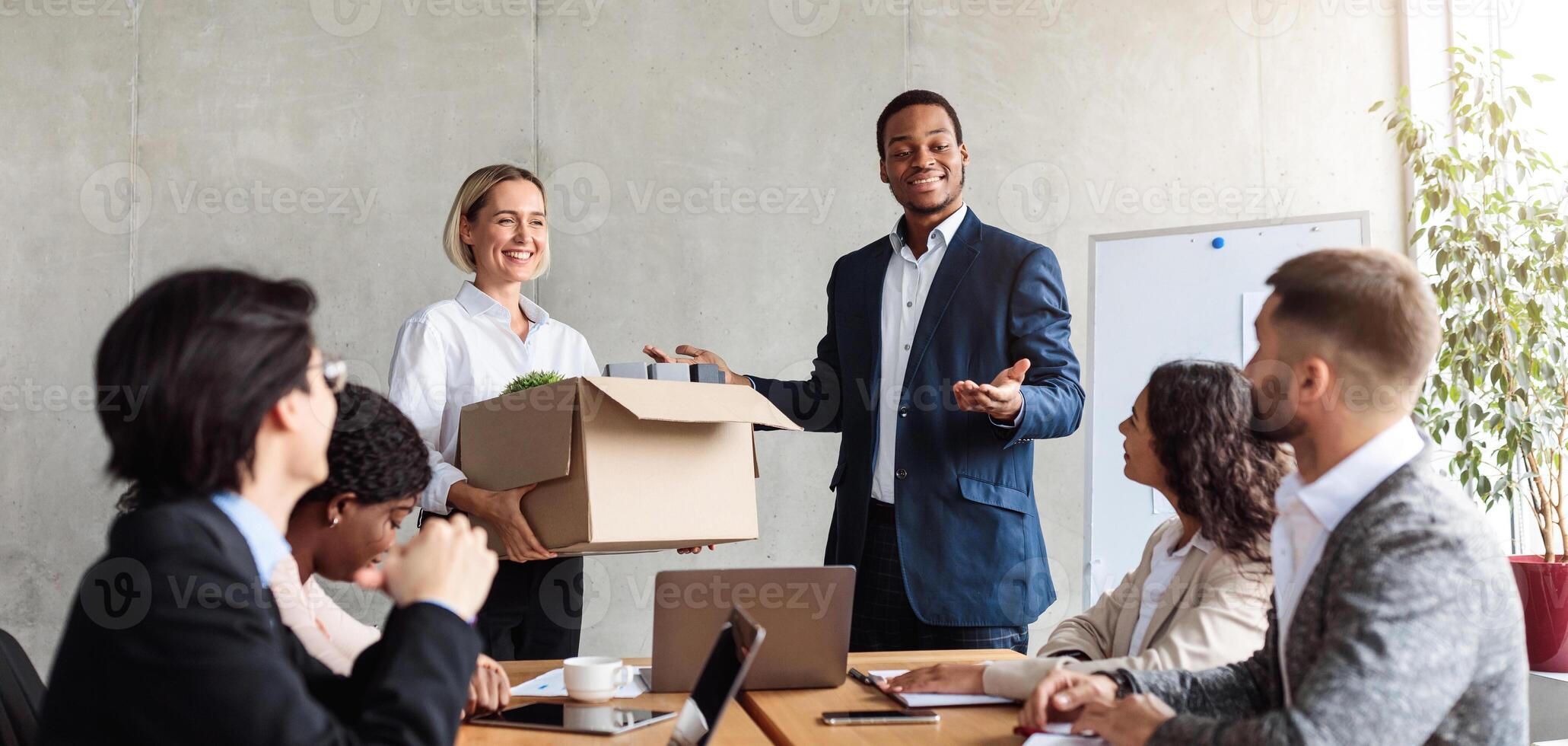 New Worker. African HR Manager Introducing New Employee To Colleagues Sitting At Desk During Corporate Meeting In Office. Job And Employment, Career Growth. Business People Lifestyle Concept photo