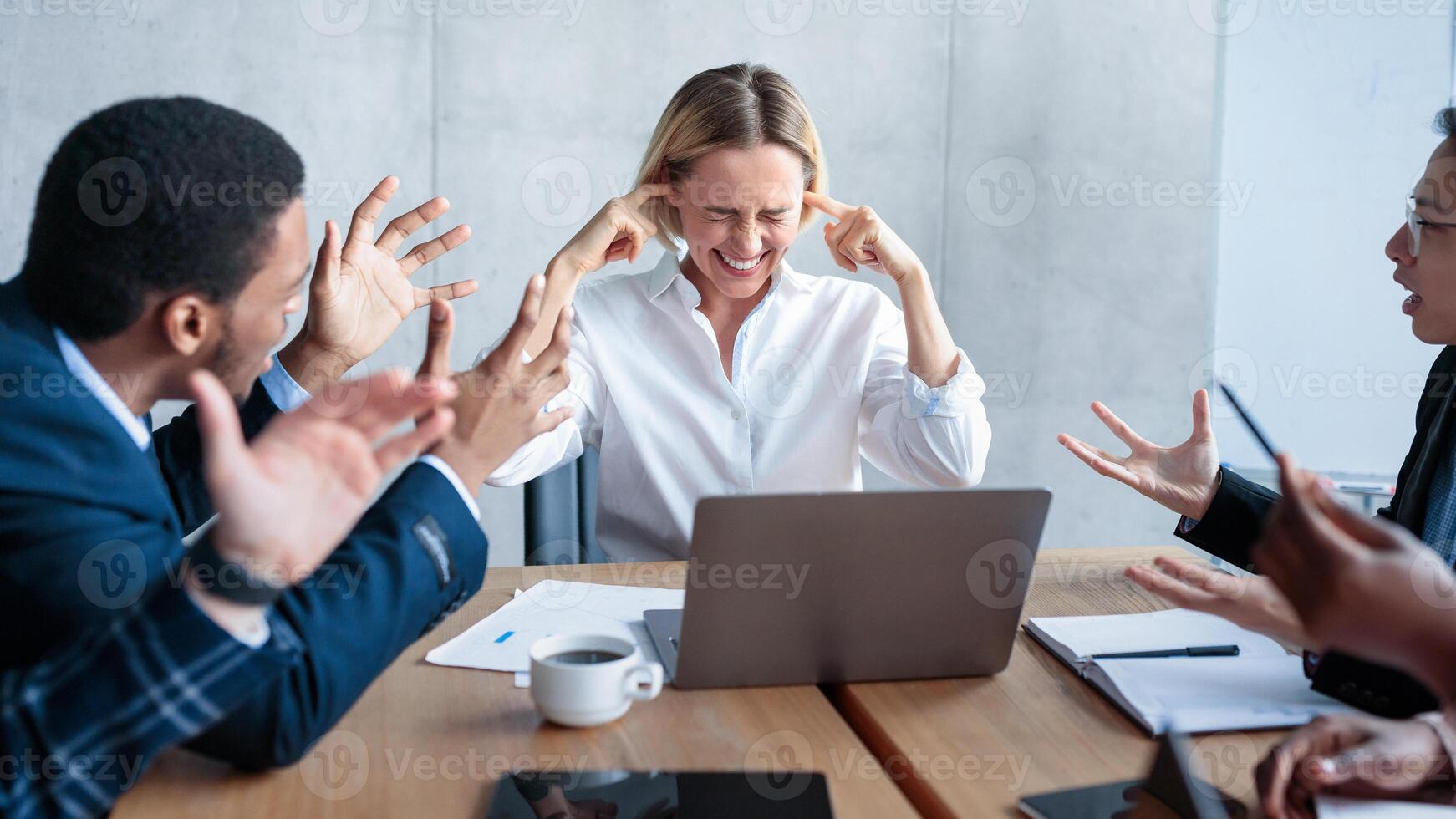 Conflict At Work. Business People Shouting At Unhappy Businesswoman Ceo Blaming And Bullying Her Sitting At Desk In Modern Office. Corporate Disagreement, Employees Communication Problem Concept photo