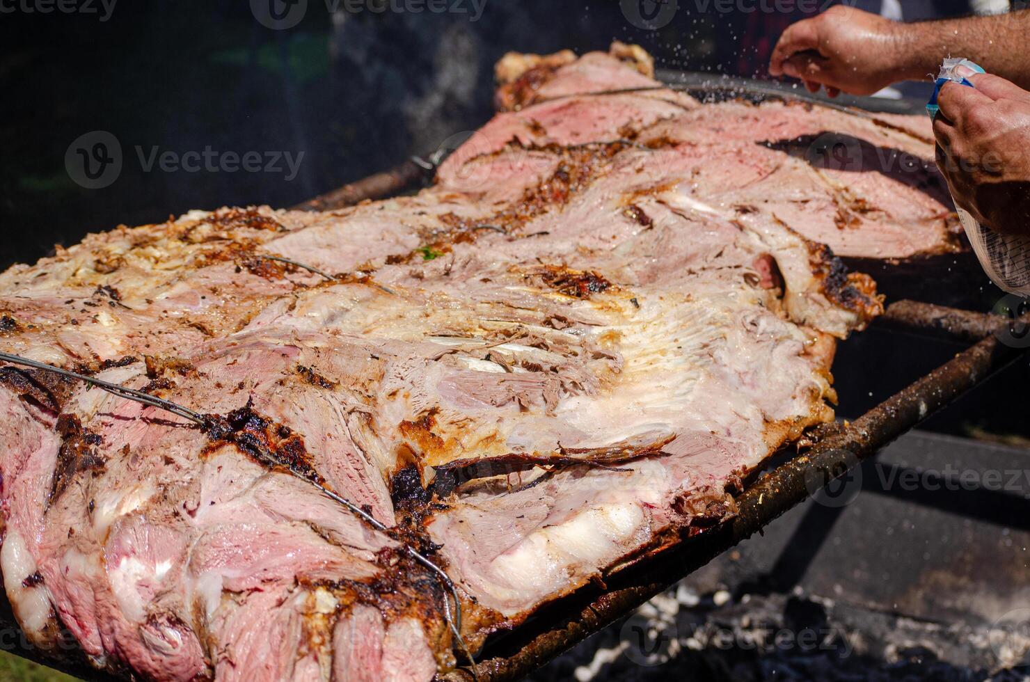 tender beef ribs slow cooked over charcoal photo