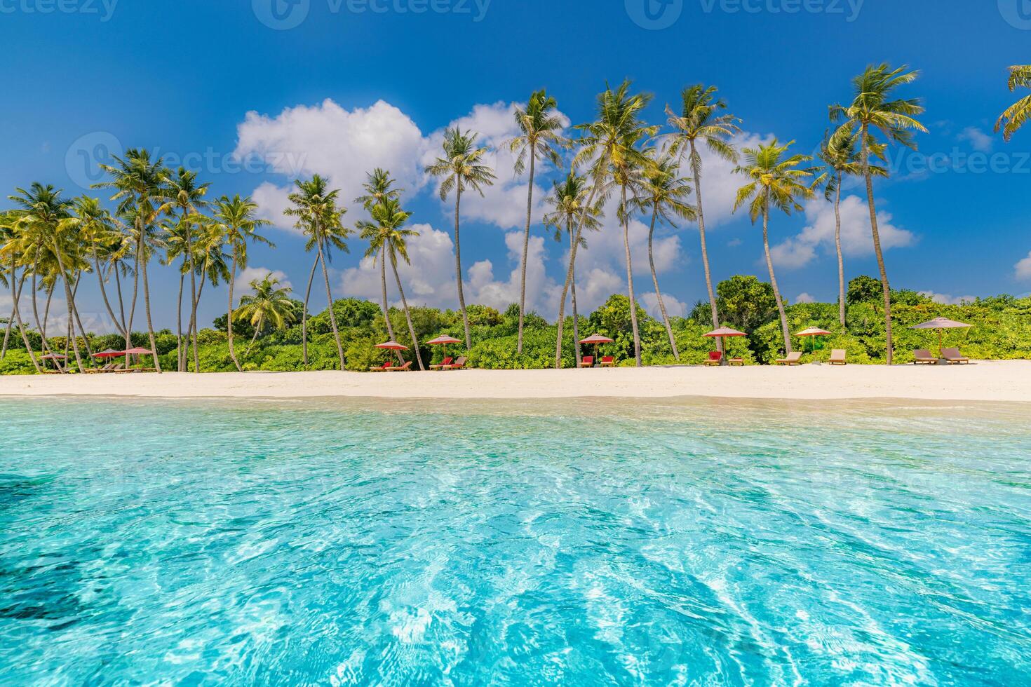 Stunning tropical luxury resort beach landscape with blue sea sky summer holiday travel destination peaceful ocean view tropical paradise vacation getaway relaxation photo