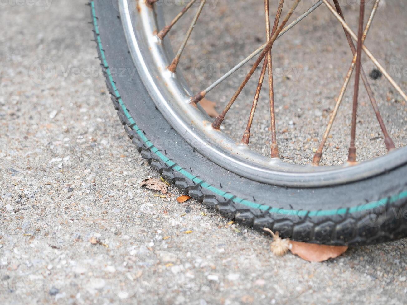 Repairing a flat bicycle tire urban setting action shot street environment close-up view cycling maintenance tips photo