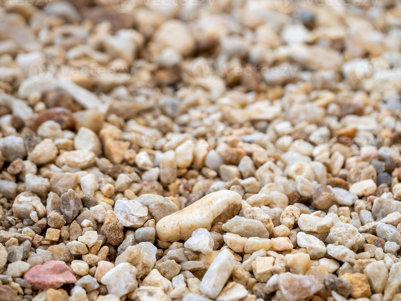 Gravel deposits in focus close-up textures of earthy ground-level environments photo