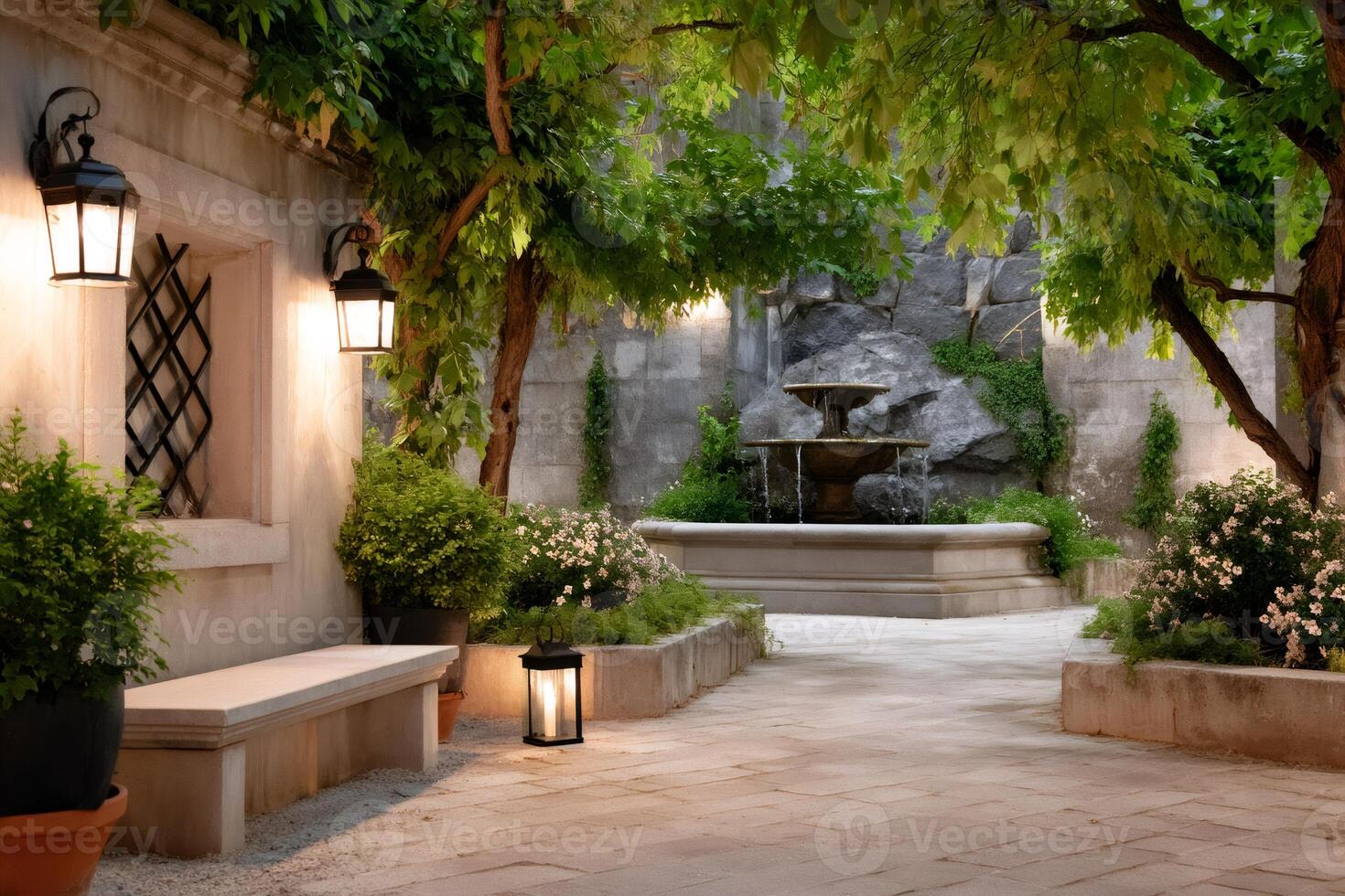 Tranquil courtyard with fountain and lush vegetation illuminated by lanterns photo