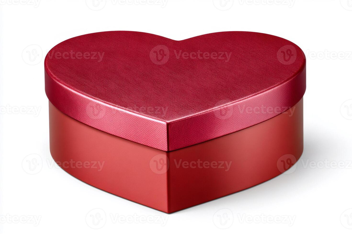 Red heart shaped gift box closed with its lid on a white background photo