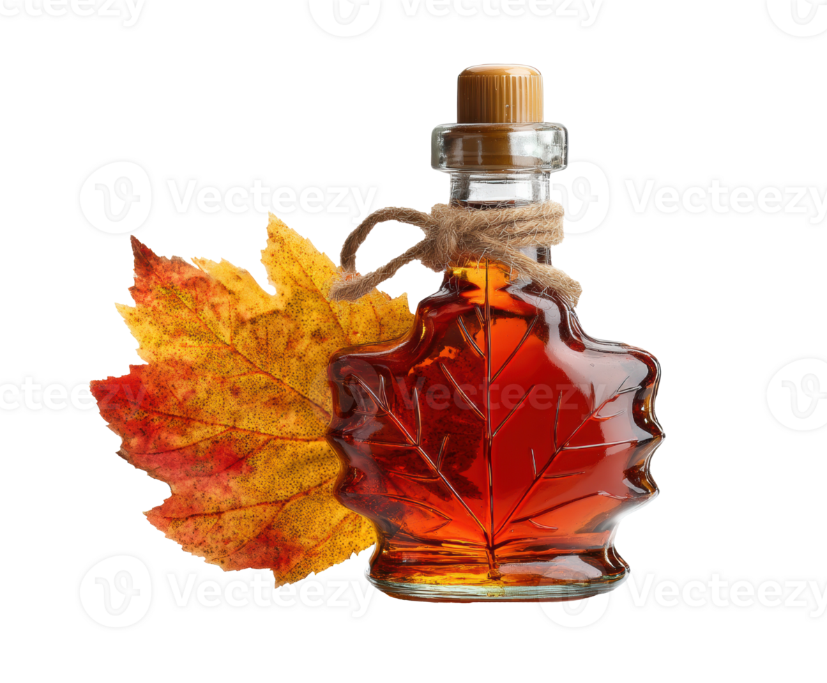 Maple syrup in glass container with autumn leaf decoration png