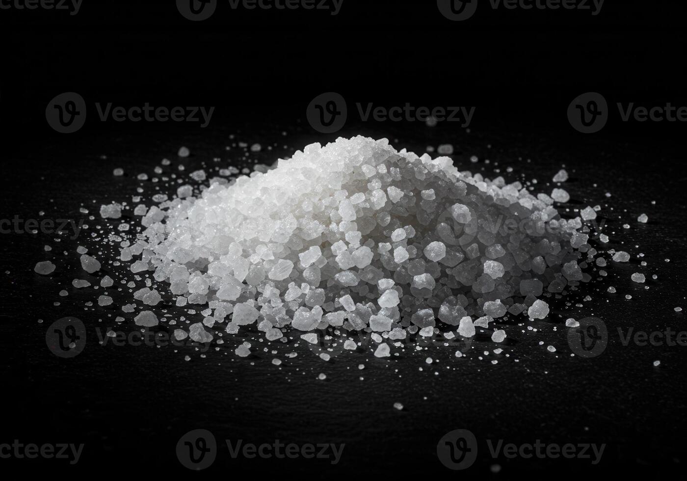 Pile of coarse salt against a dark background photo