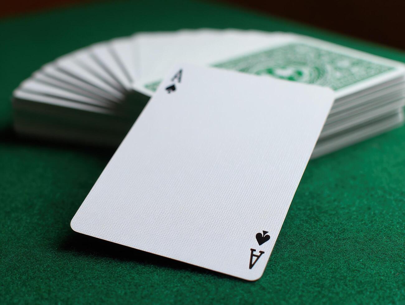 A Vintage Playing Card Template On A Felt Surface photo