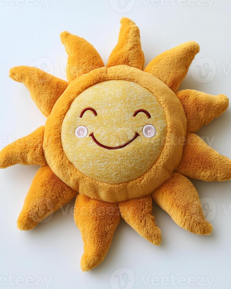 A yellow sun shaped pillow with a smiley face photo
