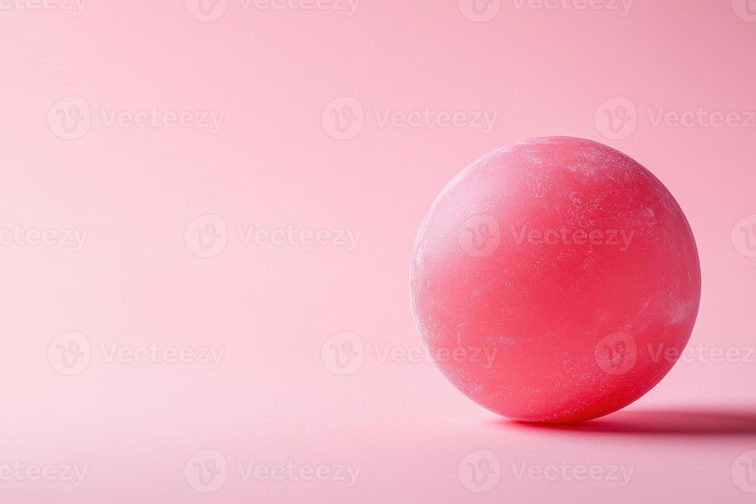 A pink egg on a pink background photo