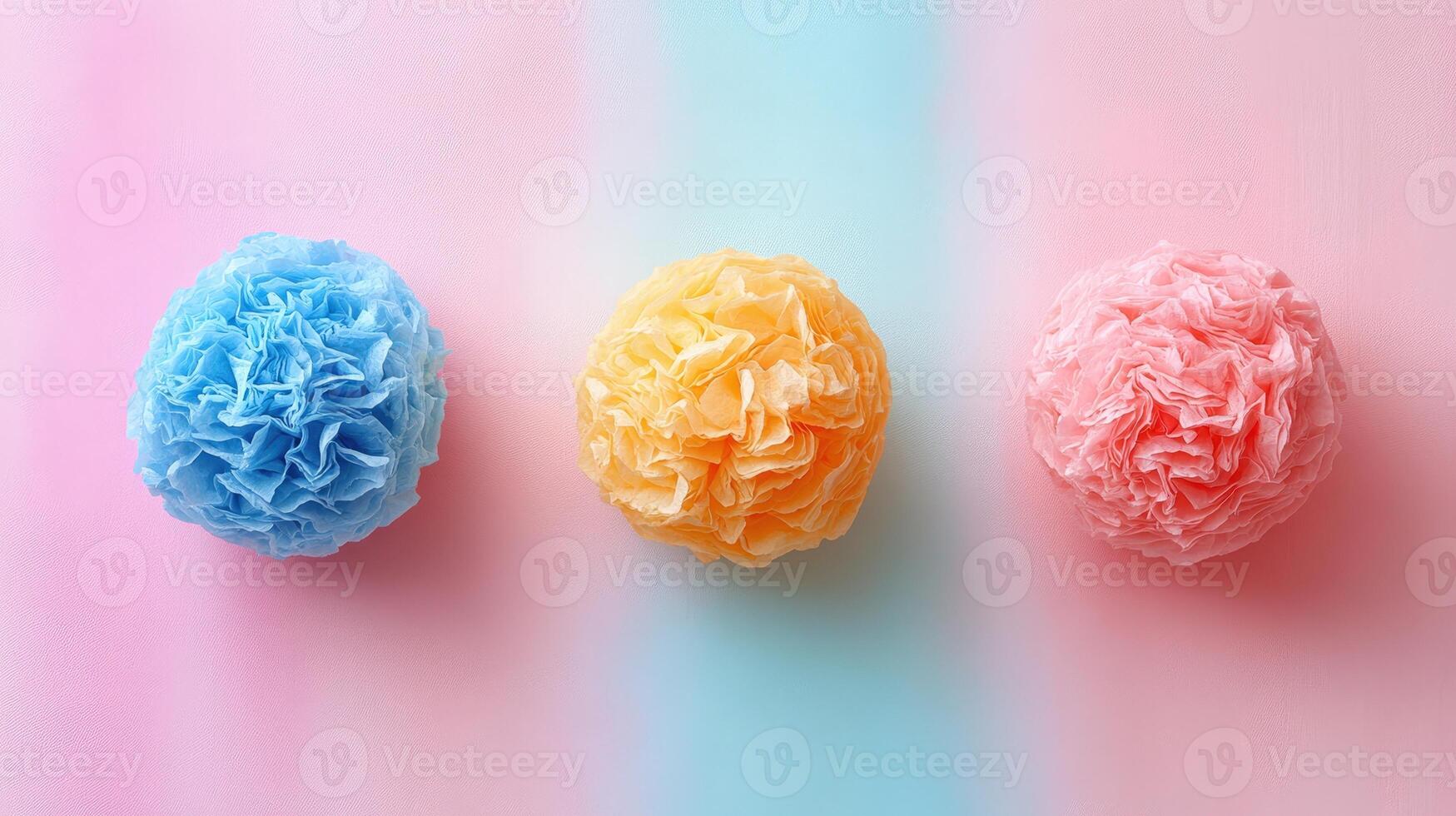 Three colorful tissue balls on a pink, blue and yellow background photo