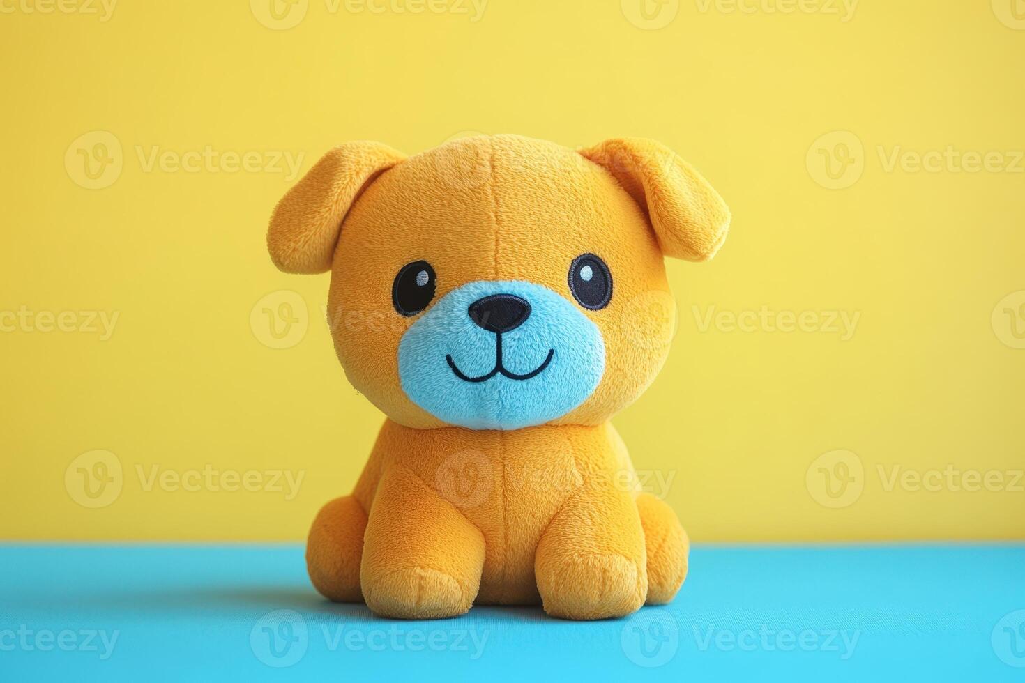 A stuffed toy dog sitting on a blue background photo