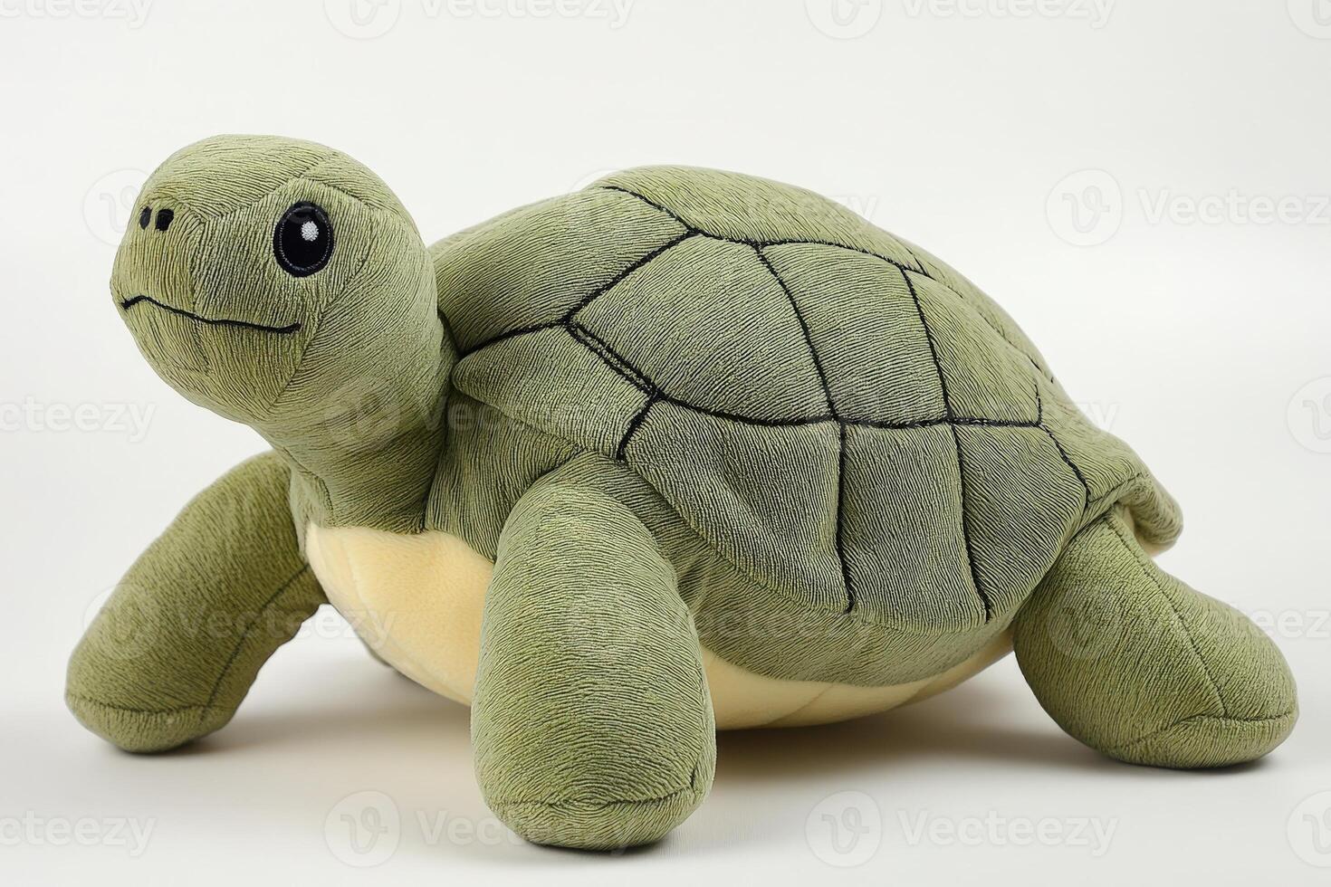 A stuffed turtle sitting on a white background photo