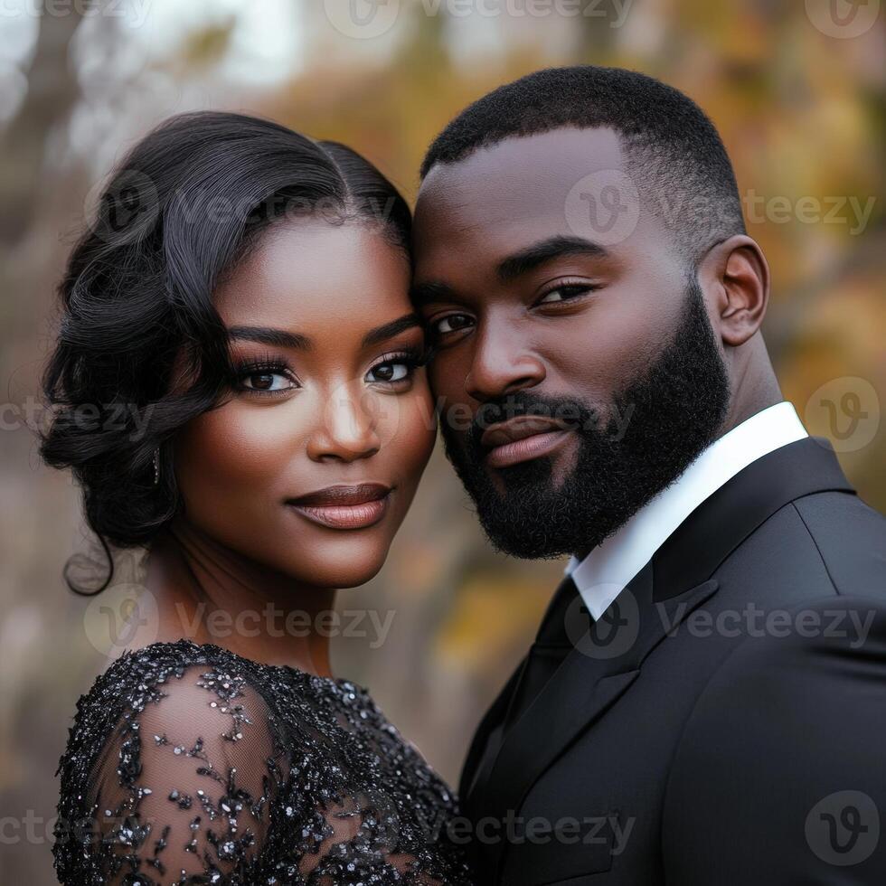 A black man and woman in formal attire photo