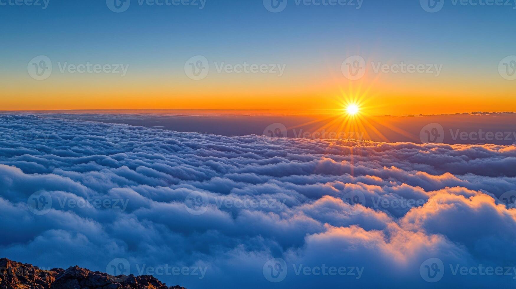 Sunrise over a sea of clouds photo