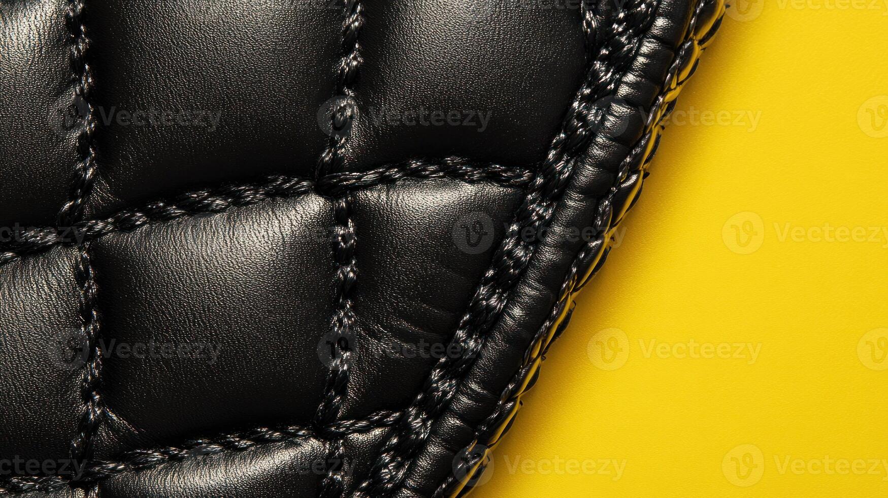 Close-up black quilted leather photo