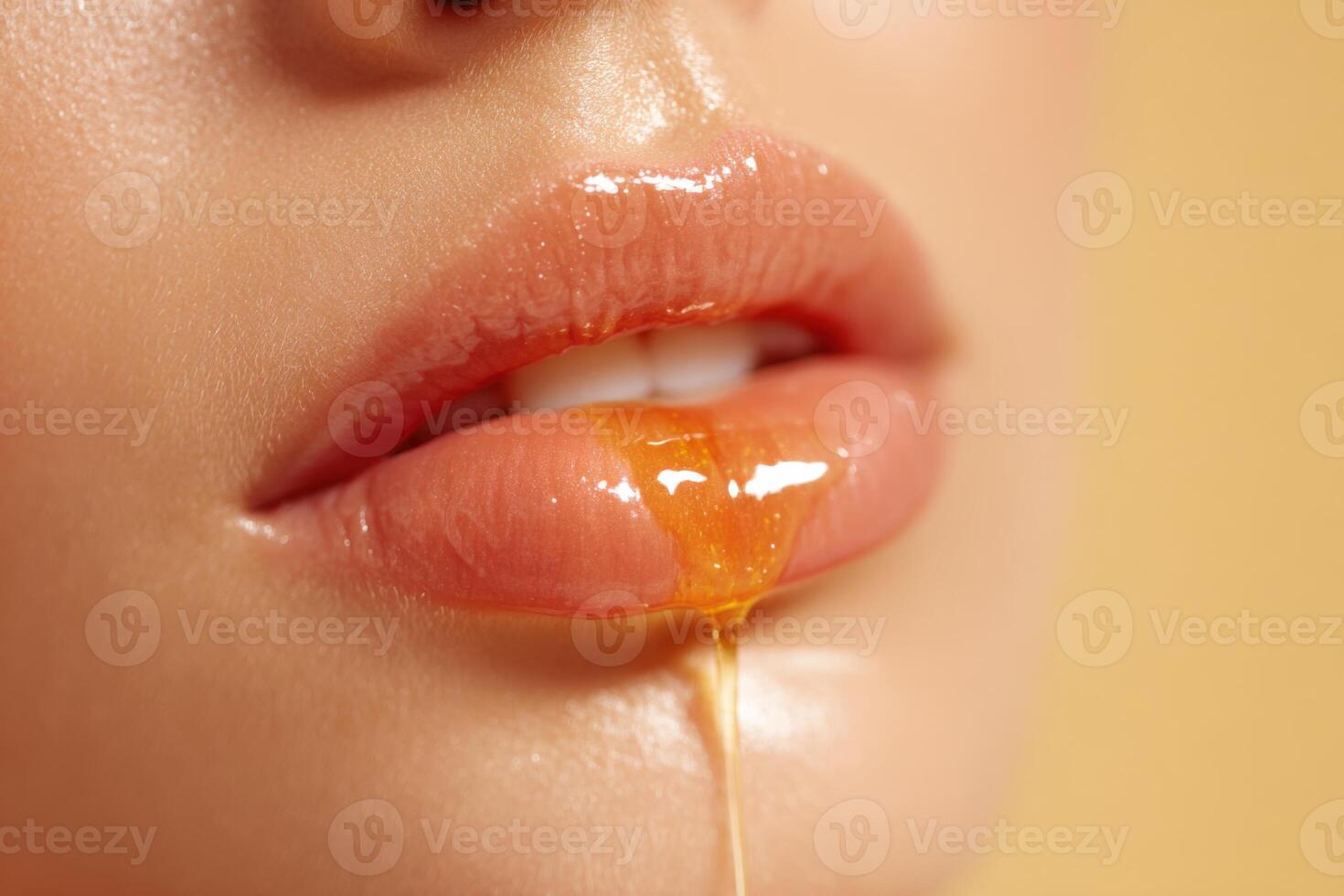 Glossy honey dripping from woman's lips, beauty and skincare concept photo