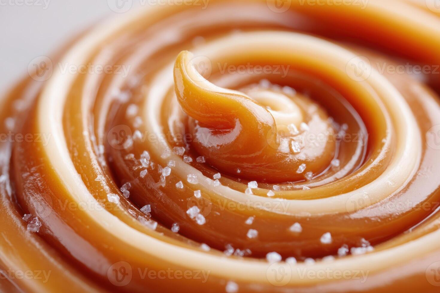 Soft caramel swirl with salt crystals forming a delicious pattern photo