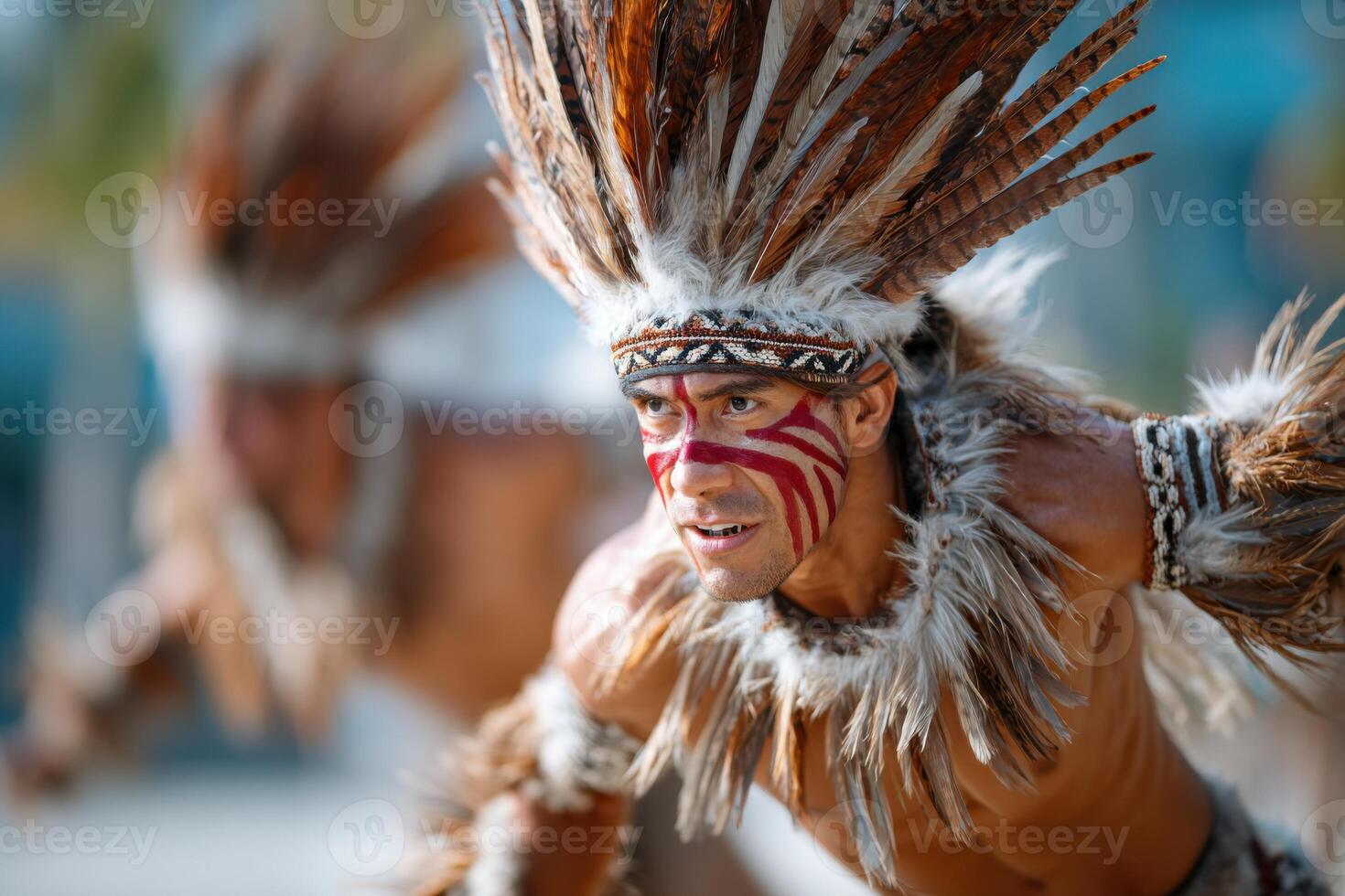 Male performer in traditional attire with feathers and body paint, showcasing cultural dance in vibrant outdoor setting, embodying heritage and celebration of tradition photo