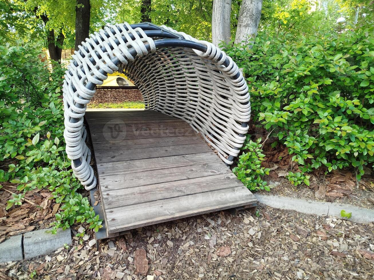 Wicker tunnel at park playground photo