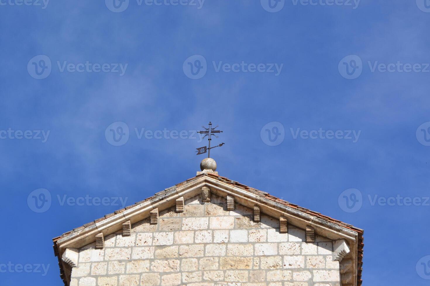 Historic architecture and clear blue sky in Brihuega, Spain - perfect for travel and cultural heritage themes. Iglesia de San Felipe. Church Saint Felipe in Brihuega, Guadalajara, Spain photo