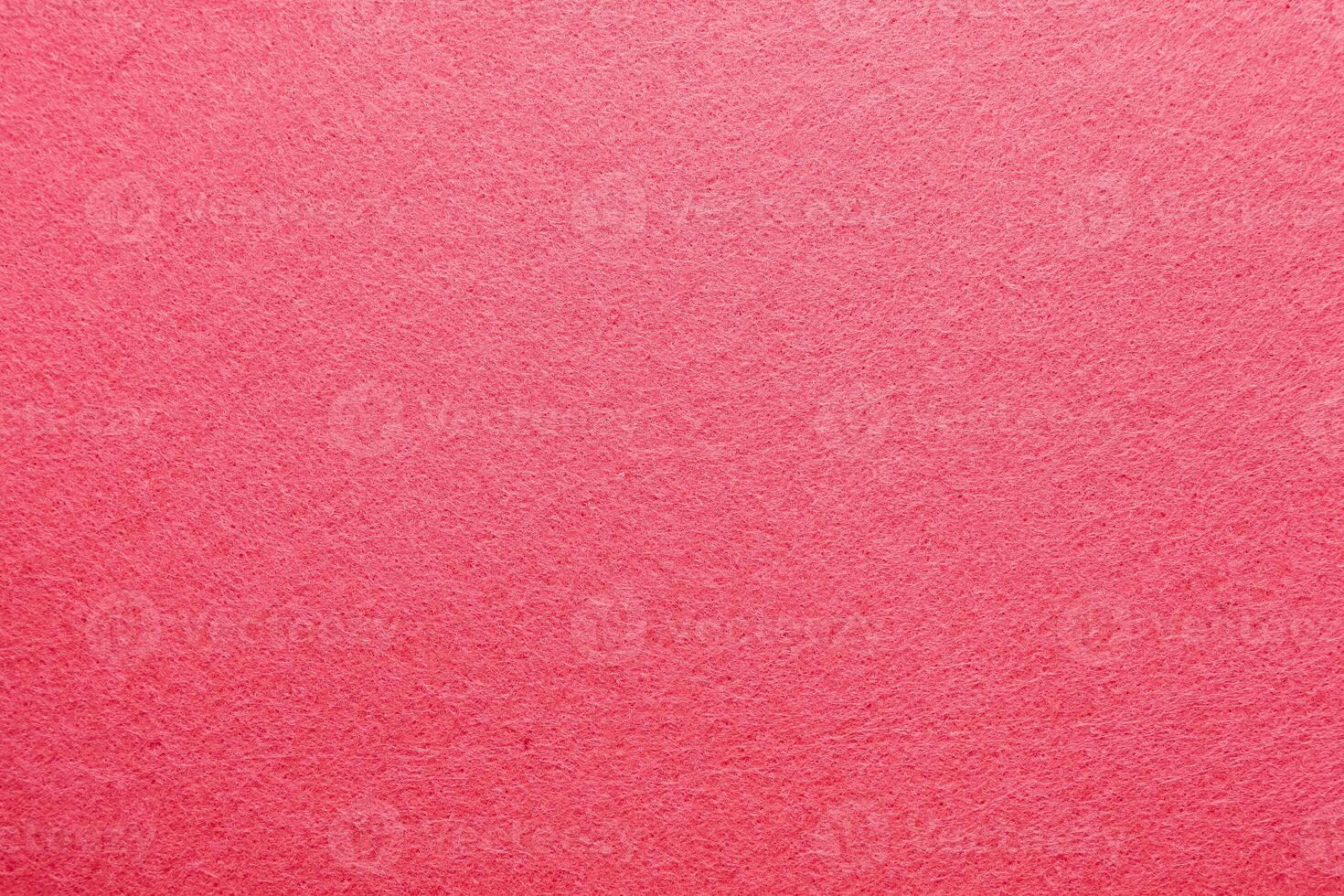 Textured pink surface creates a vibrant backdrop for artistic projects or crafts photo