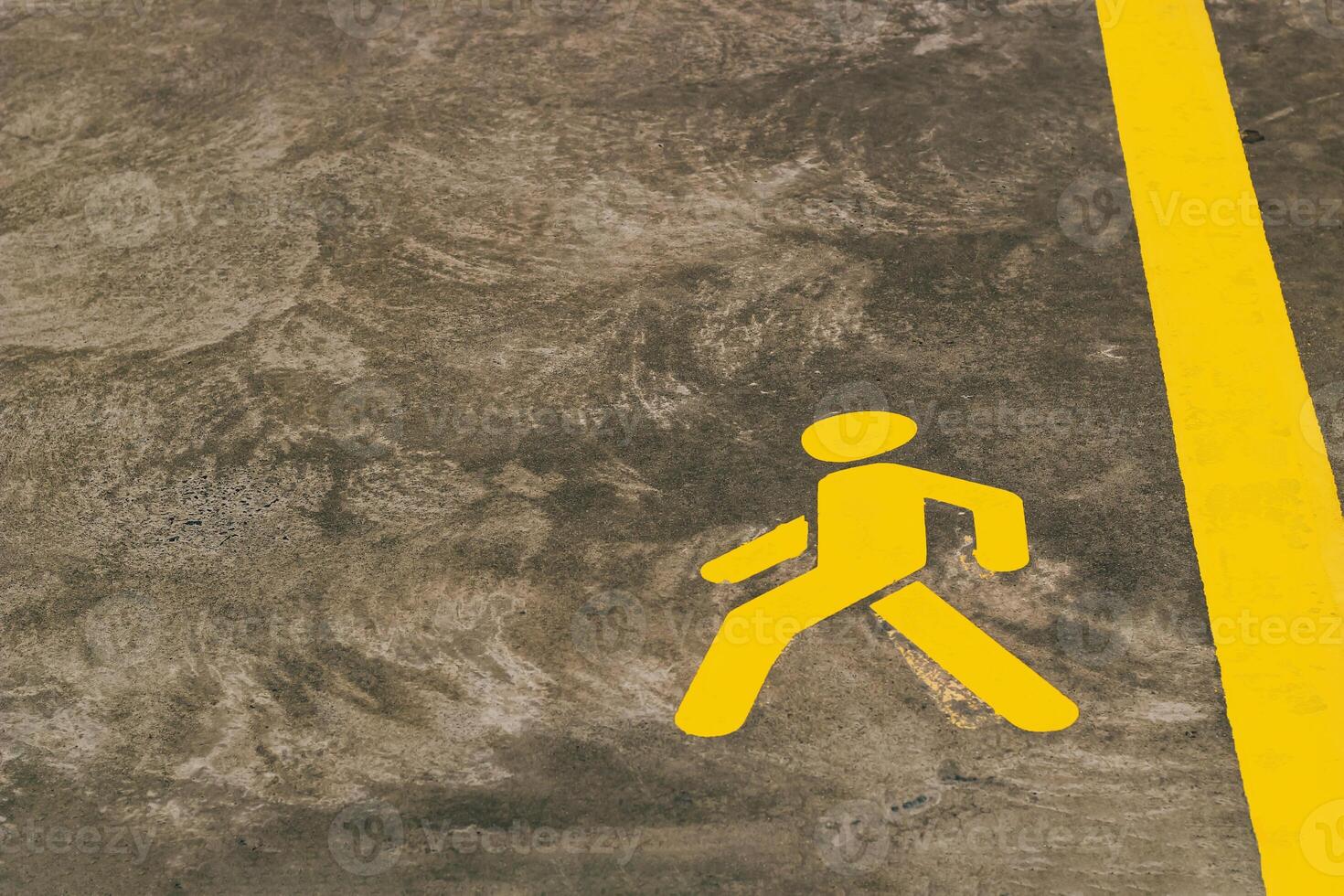 Walking path marking on concrete surface in urban area during daylight hours photo