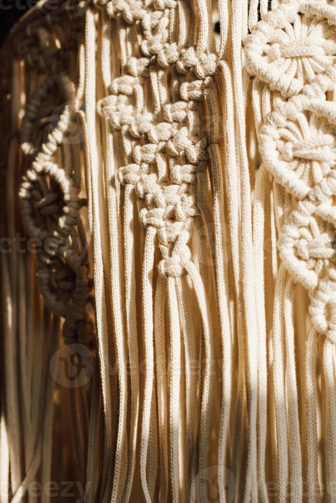 Intricate macrame design showcasing craftsmanship in neutral tones and textures photo