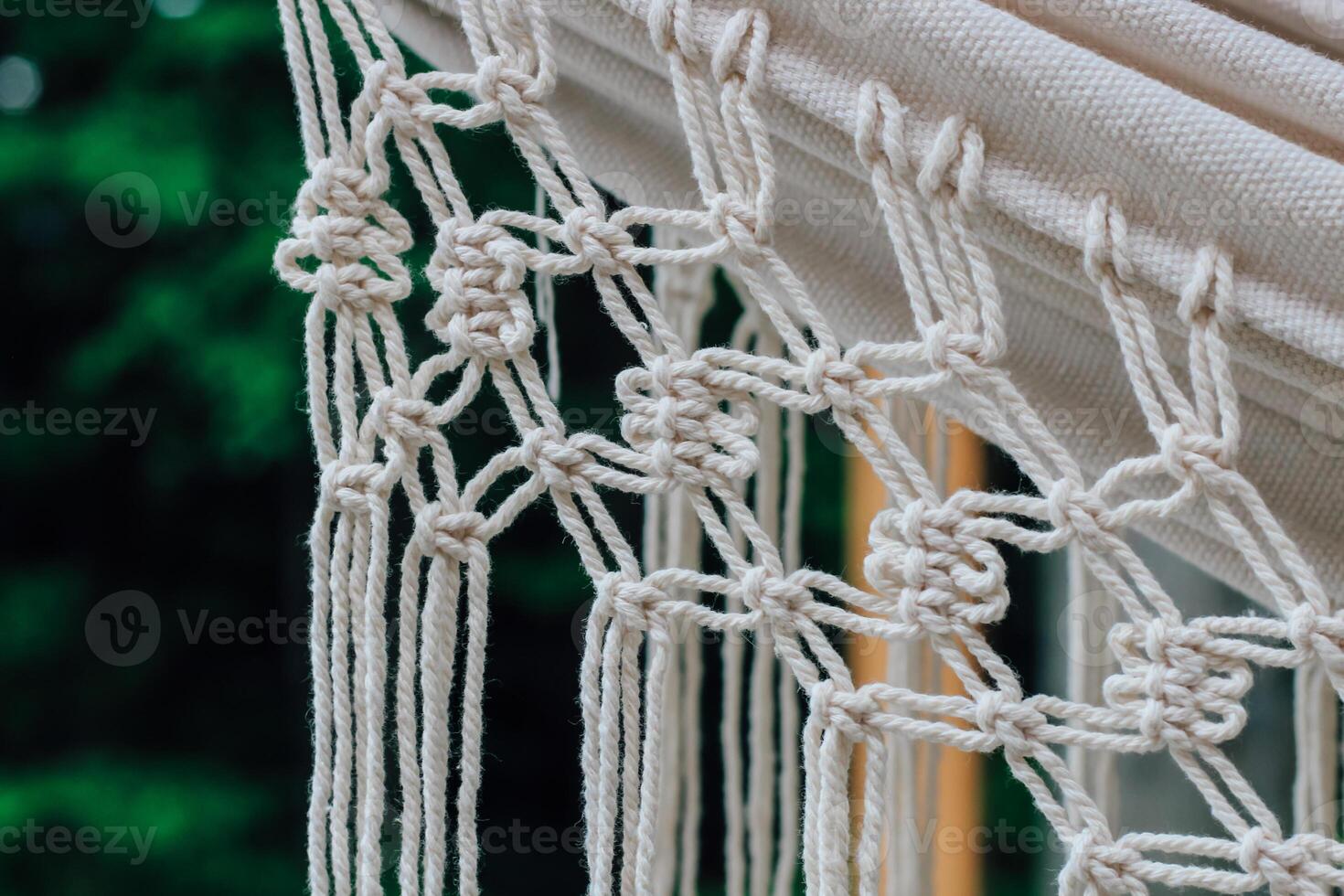 Crafting intricate macrame patterns in natural light during a serene afternoon photo