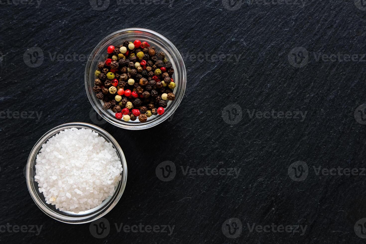 Spices and salt on dark surface for culinary preparation and seasoning photo