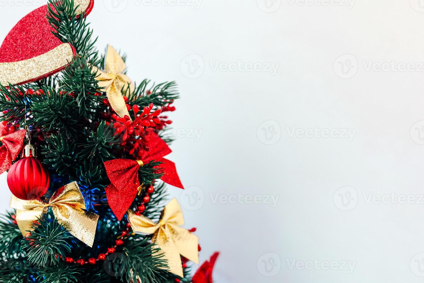 Christmas tree decorations in vibrant red and gold hues create a festive atmosphere photo