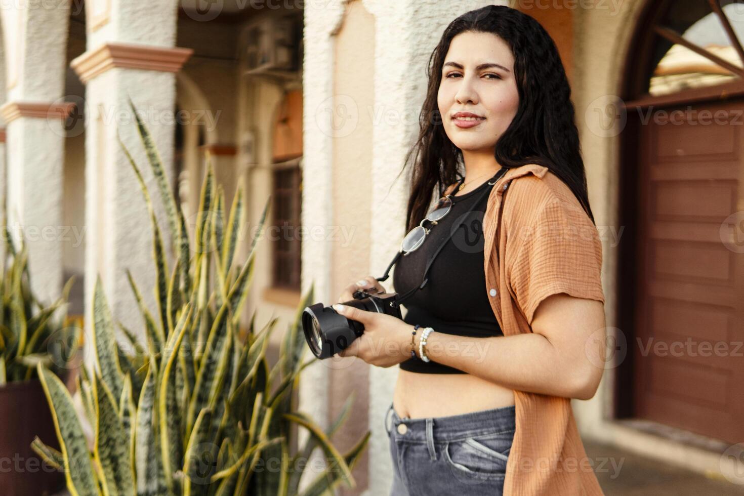 Photographer exploring local culture during travel photography session photo