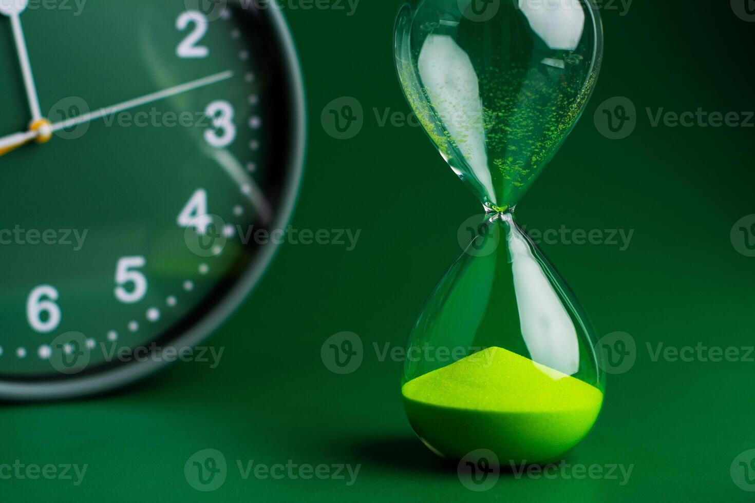 Hourglass stops time of work and life. Process and rules of limited time photo