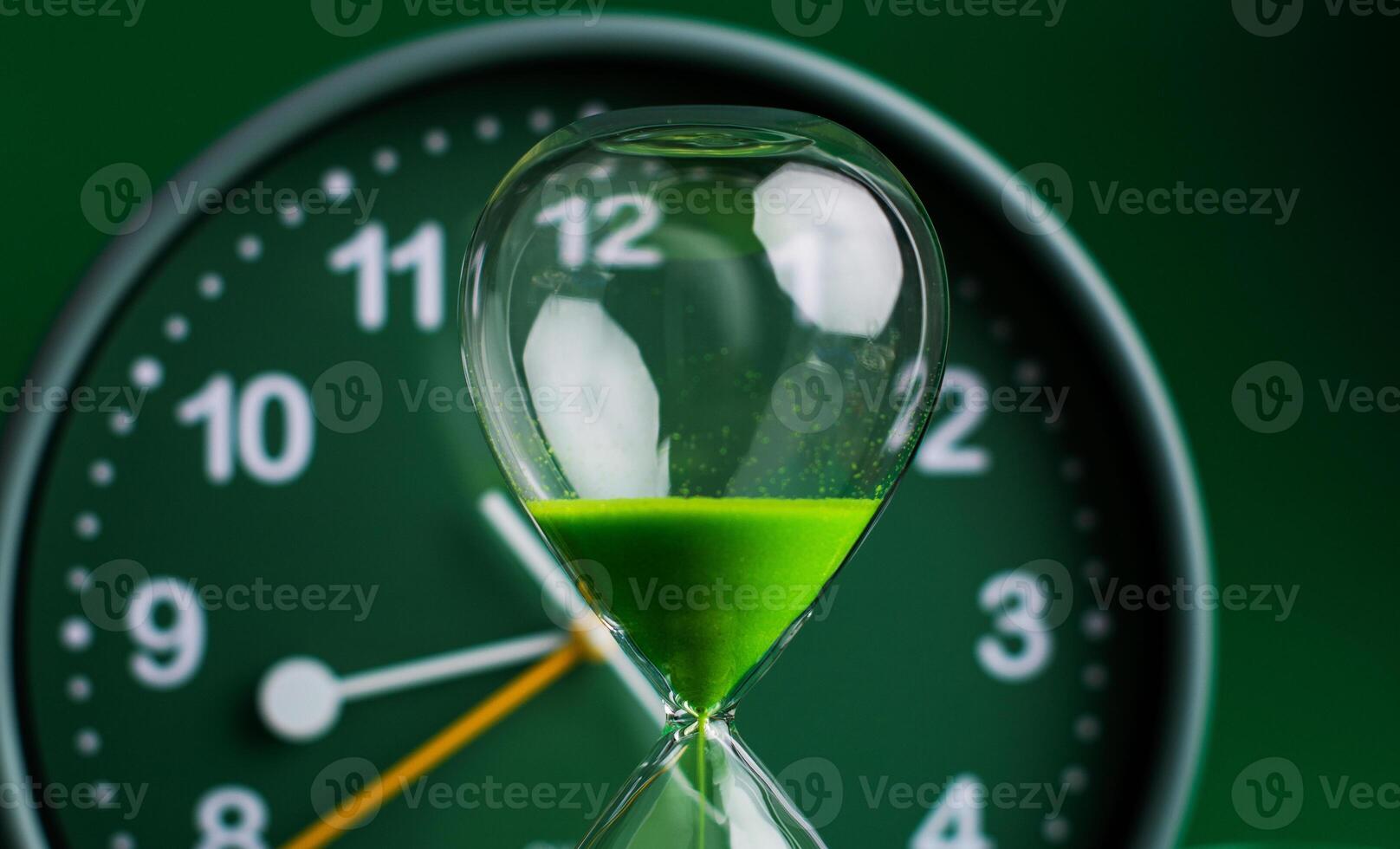 Hourglass stops time of work and life. Process and rules of limited time. photo